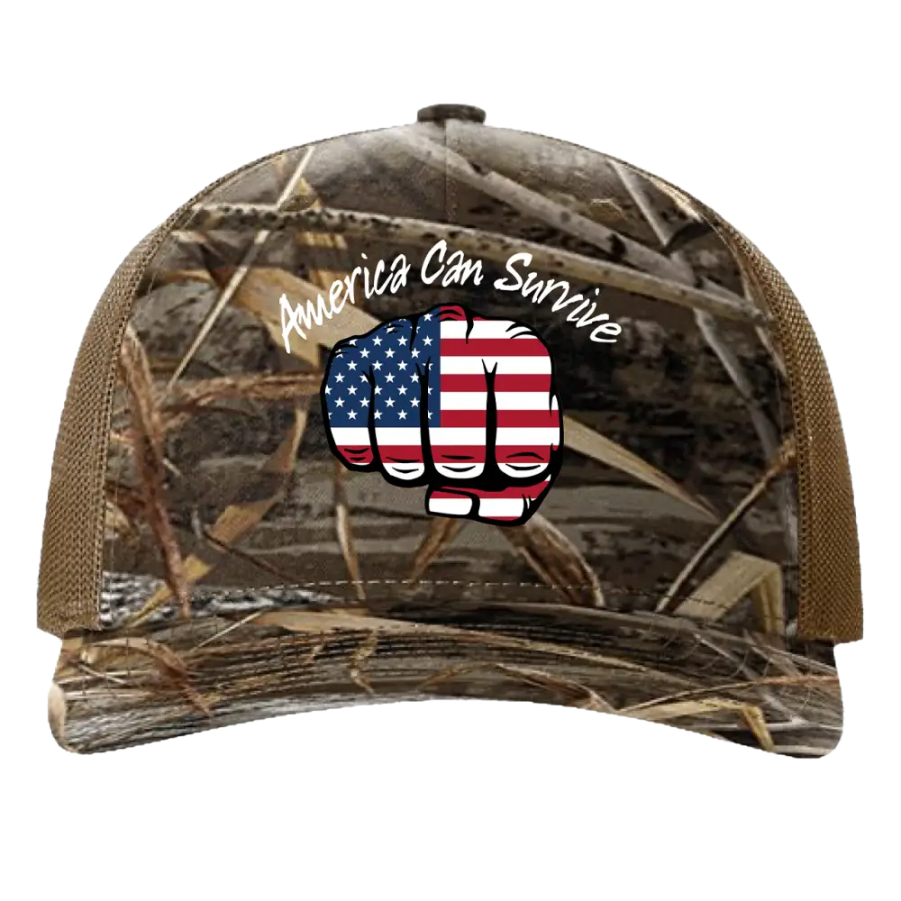 Camouflage-patterned baseball cap with an American flag fist design and ’America Can Survive’ text.