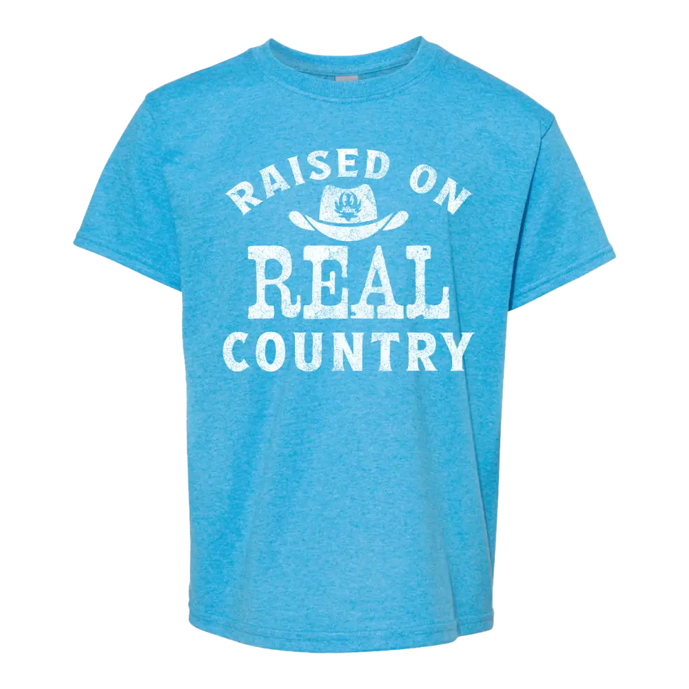 Blue t-shirt with ’Raised on Real Country’ text.