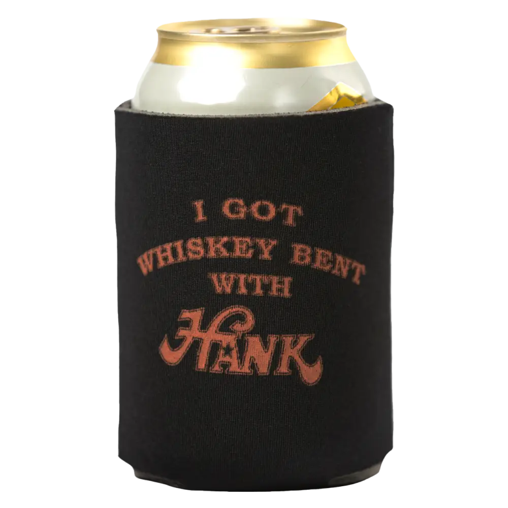 Black drink koozie with orange text reading ’I GOT WHISKEY BENT WITH HANK’ holding a beverage can.