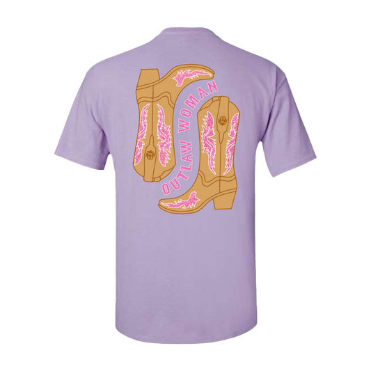 Lavender t-shirt with a graphic design of two cowboy boots on the back.